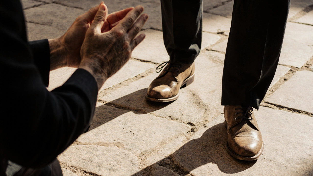 Close-up of hands clapping and feet tapping a traditional flamenco rhythm on stone.